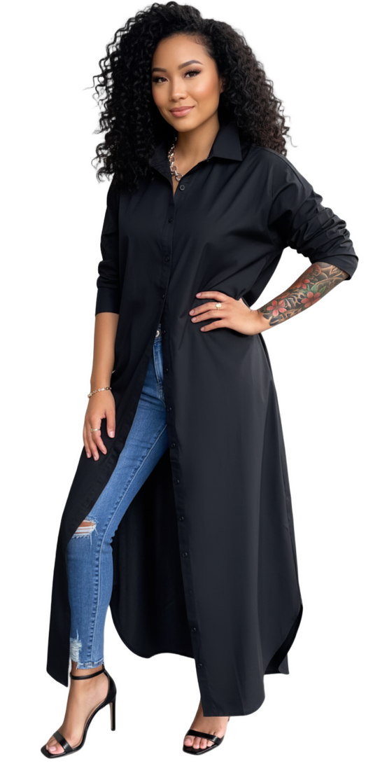 Woman wearing a long black shirt and blue jeans on a white background