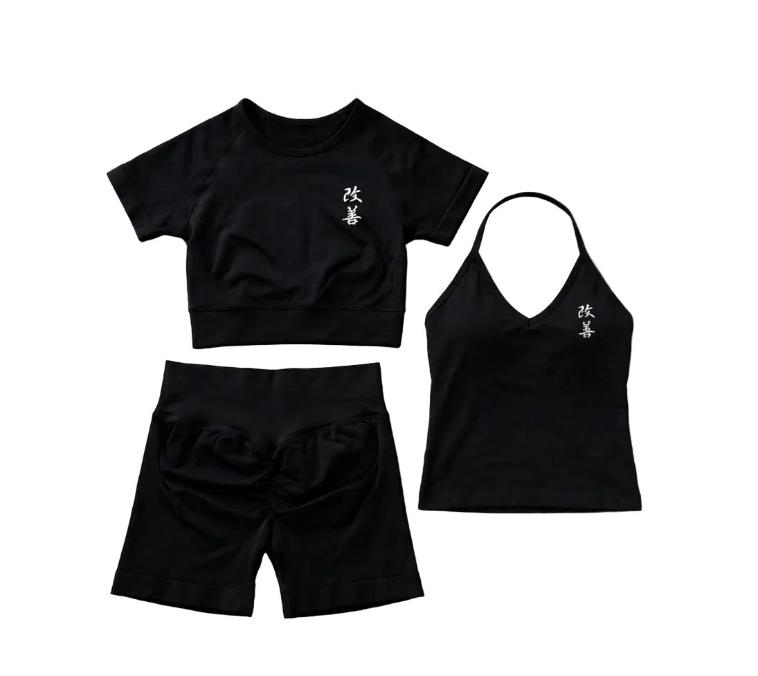 Black athletic outfit with text on a wooden floor