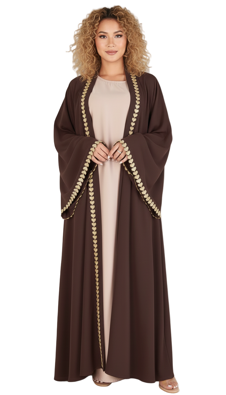 Woman wearing a brown abaya with gold trim on a white background