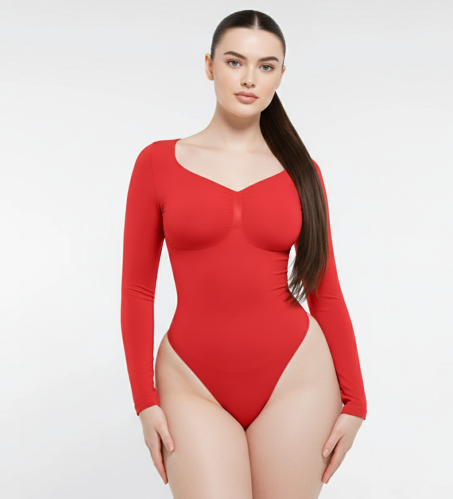 Woman wearing a red bodysuit on a white background