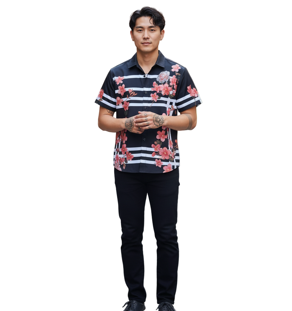 Man wearing a floral and striped shirt standing on a street.