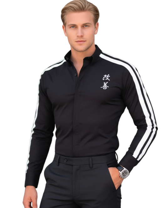 Man wearing a black outfit with white stripes in an urban setting