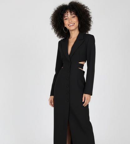 Woman wearing a black long coat with cut-out details on a white background