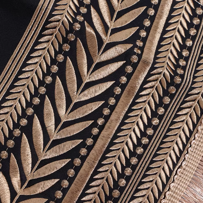 Close-up of a detailed leaf pattern on a textured surface