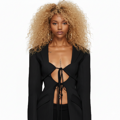 Woman wearing a black outfit with a deep neckline on a white background