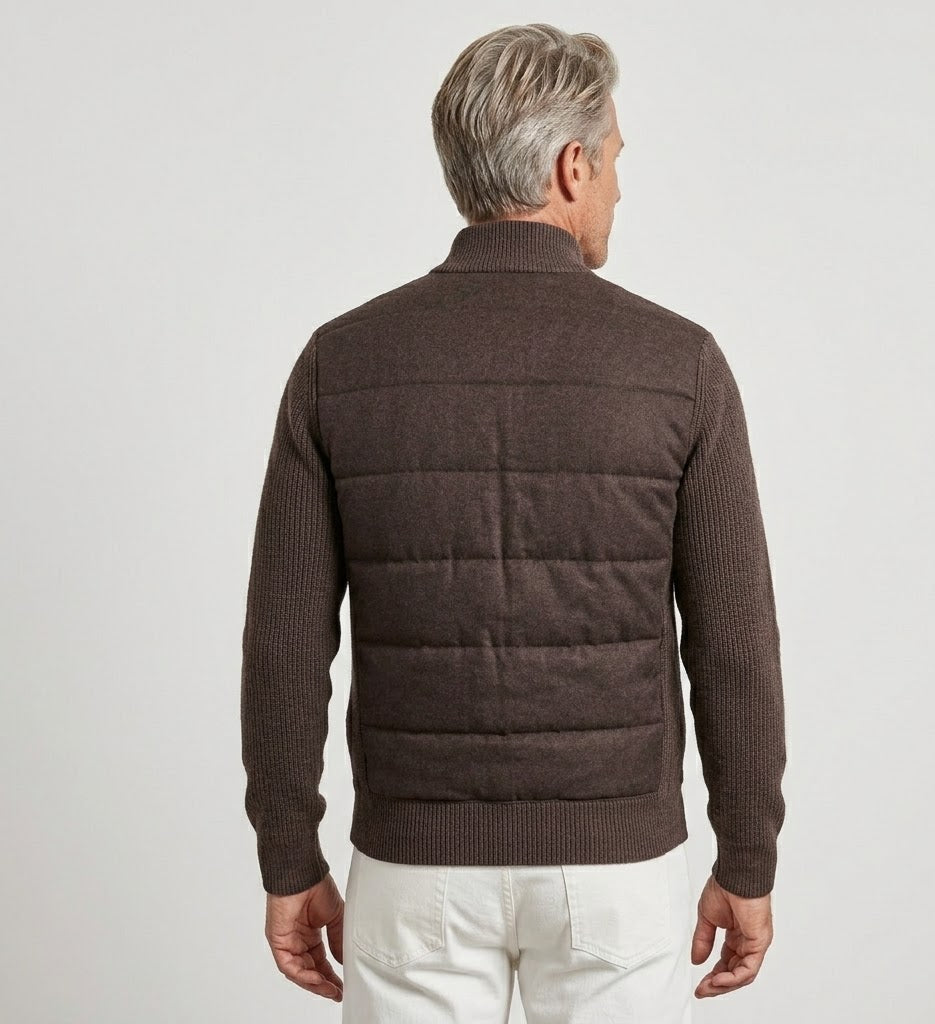 Man wearing a brown quilted jacket on a light gray background