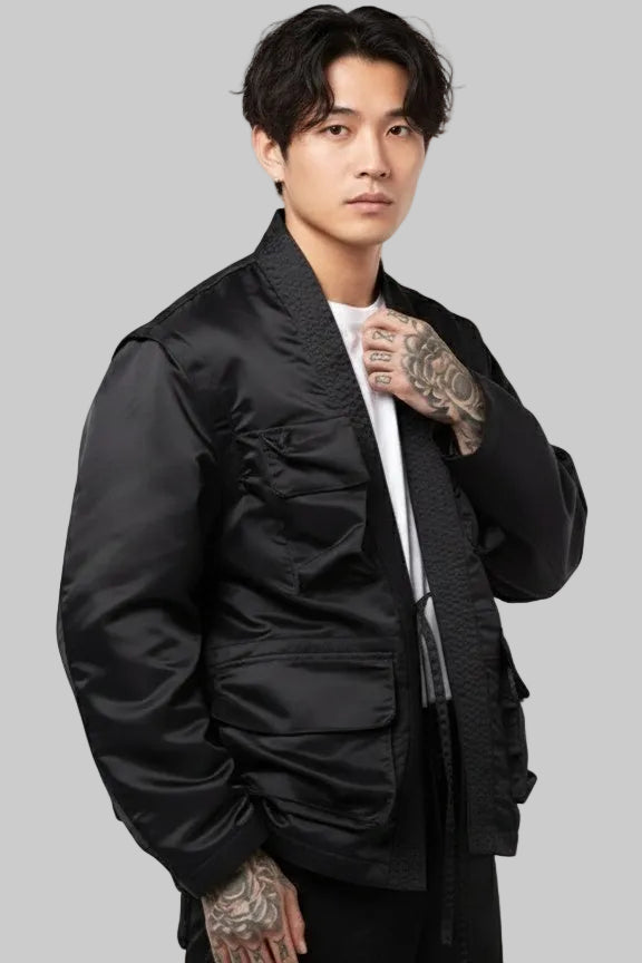 Man wearing a black bomber jacket on a white background