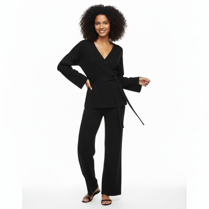 Woman wearing a black outfit on a white background