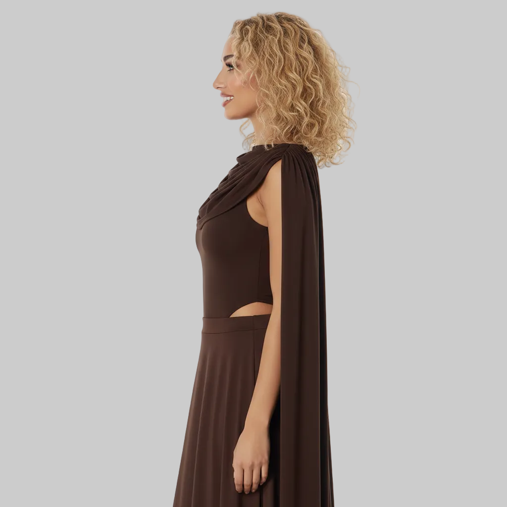 Woman wearing a brown dress with a cape on a white background