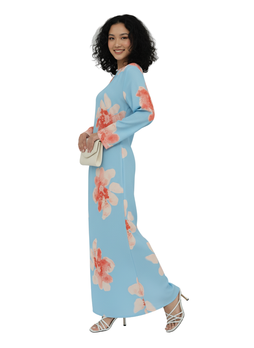 Woman wearing a light blue floral dress on a white background