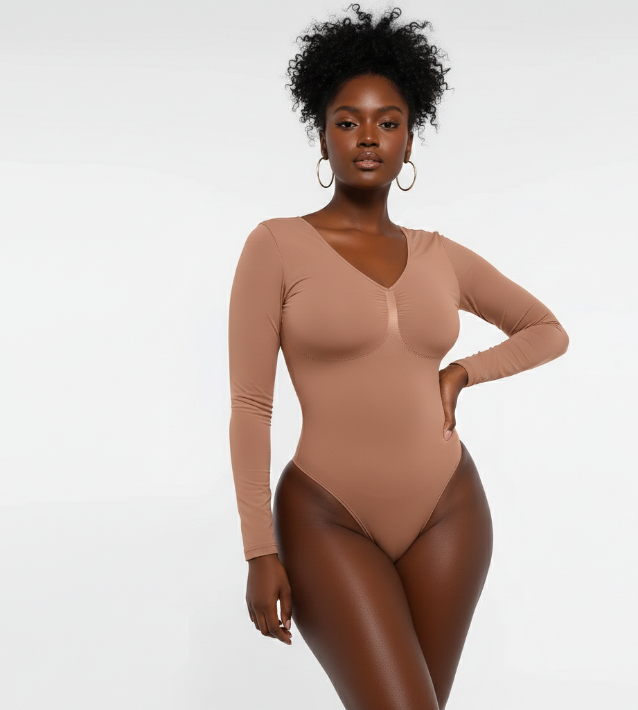 Woman wearing a brown bodysuit against a white background