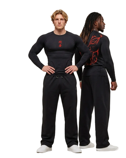Two men wearing black athletic outfits with red designs on a plain background